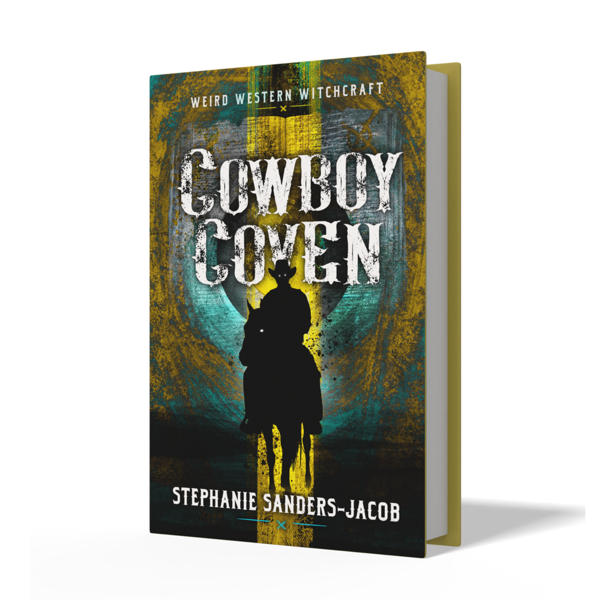 A book cover for 'Cowboy Coven' by Stephanie Sanders-Jacob, featuring a dark silhouette of a cowboy on a horse against a mystical green and gold background. The book is shown standing upright at a slight angle to reveal its gold spine, set against a clean white background with a soft shadow.